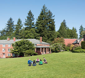 Photo of students sitting on lawn. Link to Gifts That Protect Your Assets.