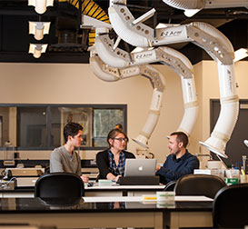 Photo of students working. Link to Closely Held Business Stock.